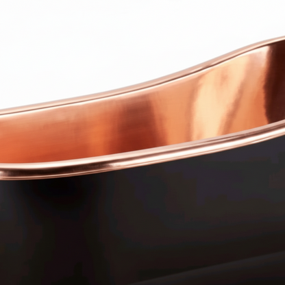 Close-up of a copper bathtub with a white background