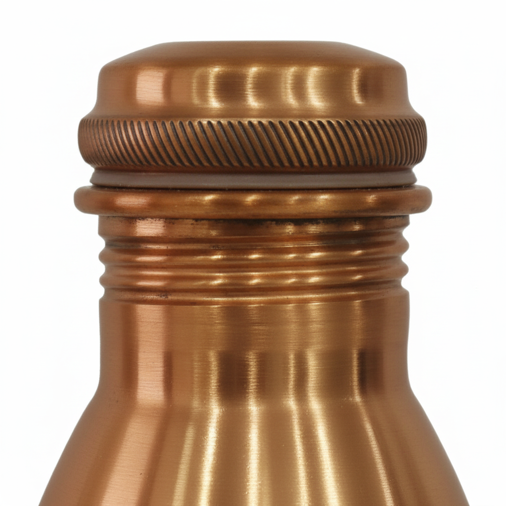 Close-up of a copper bottle cap on a white background