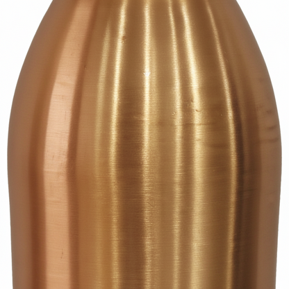 Close-up of a bronze-colored bottle on a white background