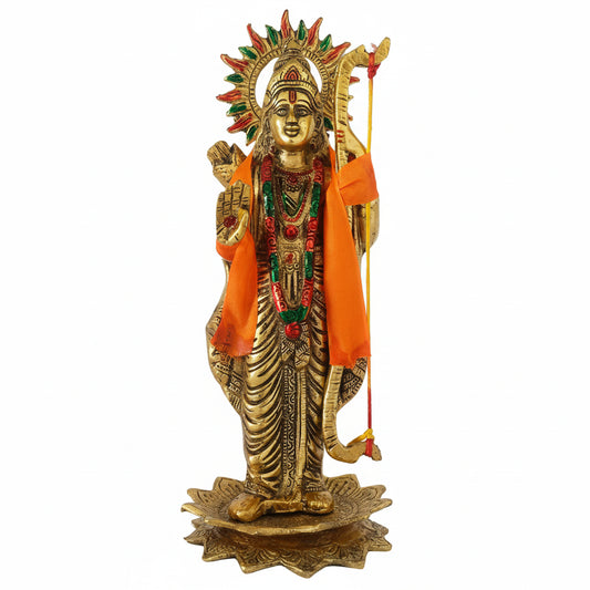 Decorative statue of a deity with gold finish, orange cloth, and colorful jewelry on a white background.