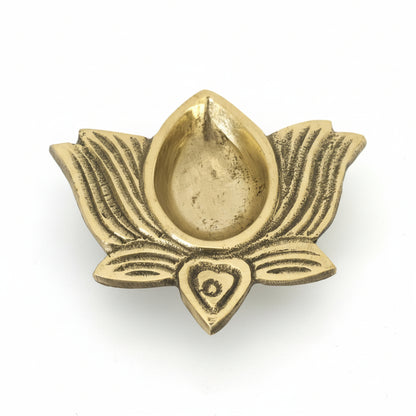 Gold-colored decorative item shaped like a lotus flower on a white background