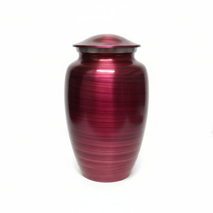 Red urn with a ribbed texture on a white background
