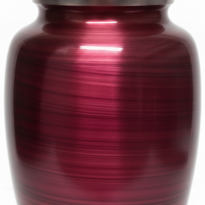 Red metal urn with a white background