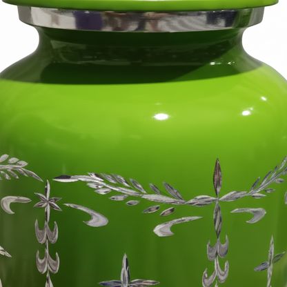 Green urn with silver floral patterns on a white background