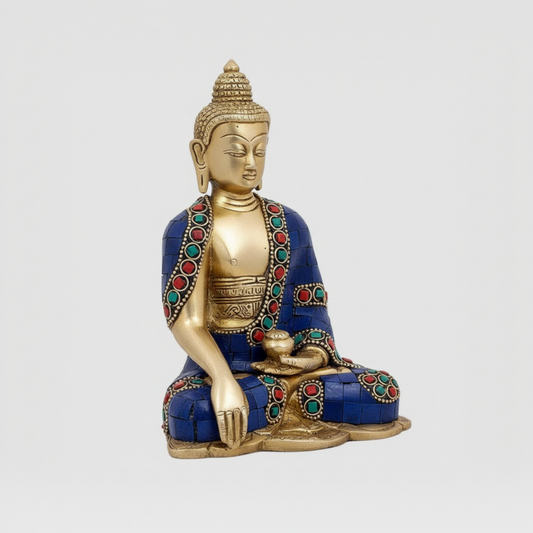 Decorative Buddha statue with blue and gold colors on a white background