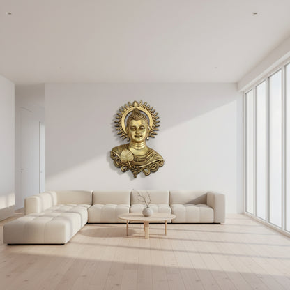 Decorative brass plaque of a Buddha face with intricate designs on a beige background