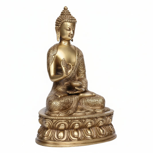 Bronze statue of a seated Buddha on a white background