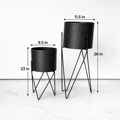 Two black metal planters with dimensions indicated on a white background