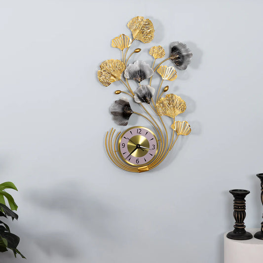 Decorative wall clock with floral design on a white wall