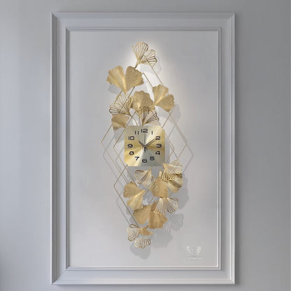 Decorative wall clock with gold leaf design on a white background