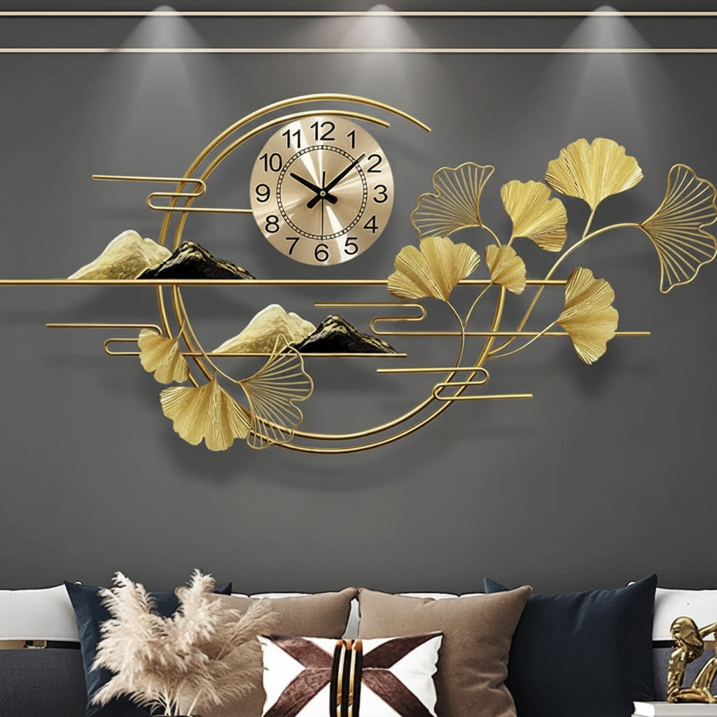 Decorative wall clock with leaf and mountain design on a gray wall above a sofa.