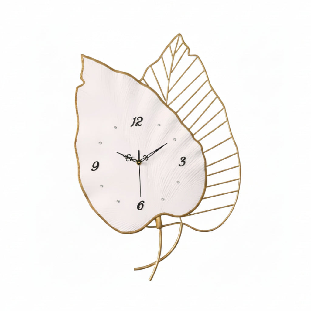 Decorative wall clock with leaf design on a white background