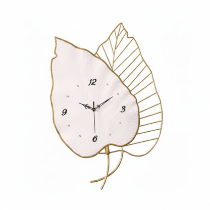 Decorative wall clock with leaf design on a white background