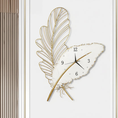 Decorative wall clock with leaf design on a white background
