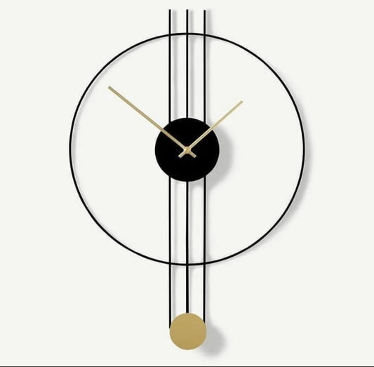 Modern wall clock with black and gold design on a white background