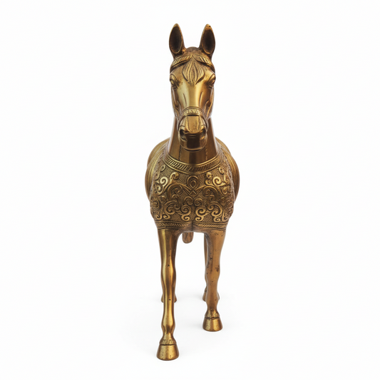 Decorative brass horse statue on a white background
