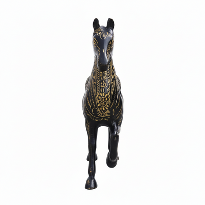 Decorative horse figurine with black and gold patterns on a white background