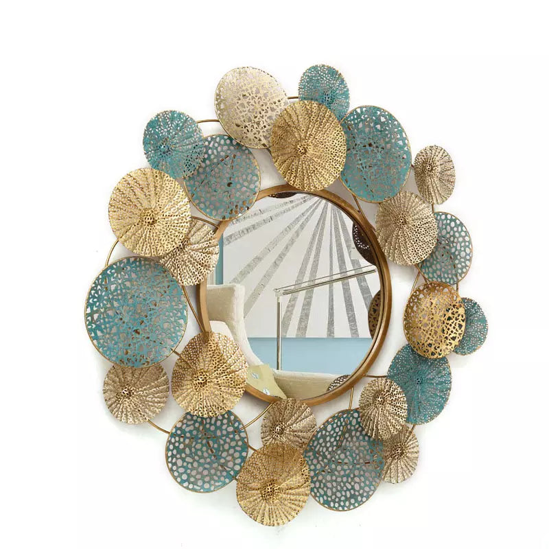 Decorative wall mirror with gold and blue circular patterns on a white background