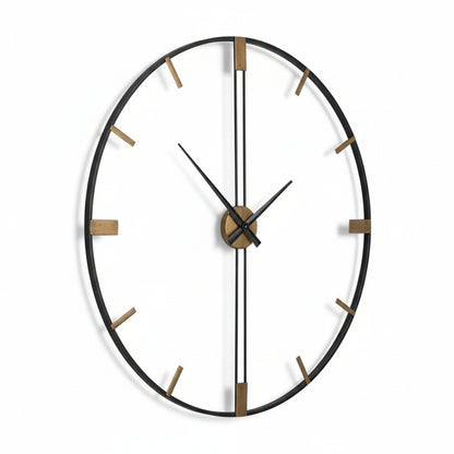 Large round wall clock with black frame and gold accents on a white background