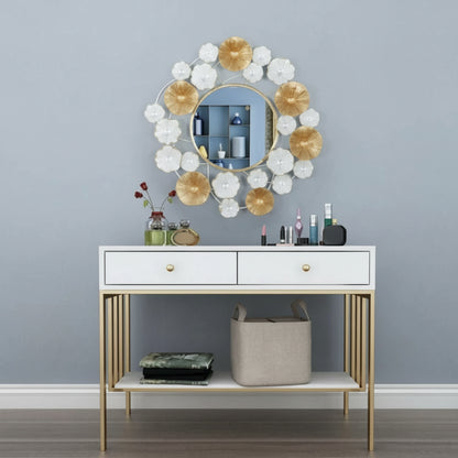 Decorative mirror with floral design above a white console table against a gray wall.