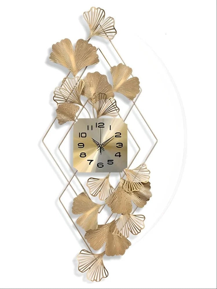 Decorative wall clock with gold leaf design on a white background
