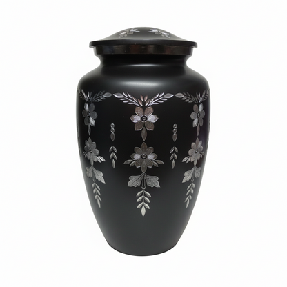 Black urn with decorative patterns on a white background