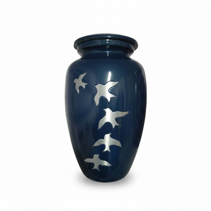 Blue urn with silver bird designs on a white background