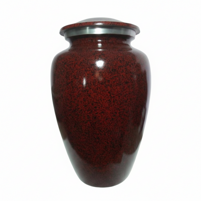 Red speckled urn with a silver top on a white background