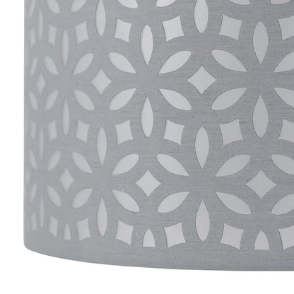 Gray fabric lampshade with a geometric white pattern