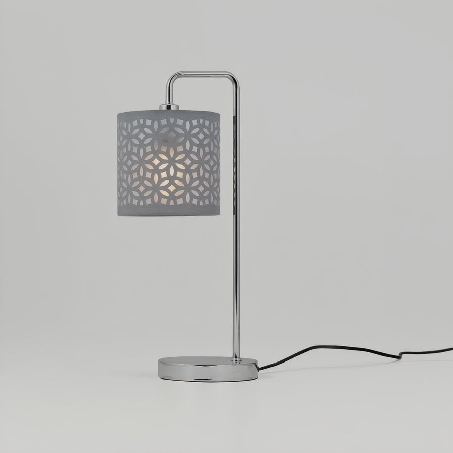 Table lamp with a gray perforated shade on a white background