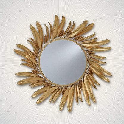 Gold sunburst mirror on a white background