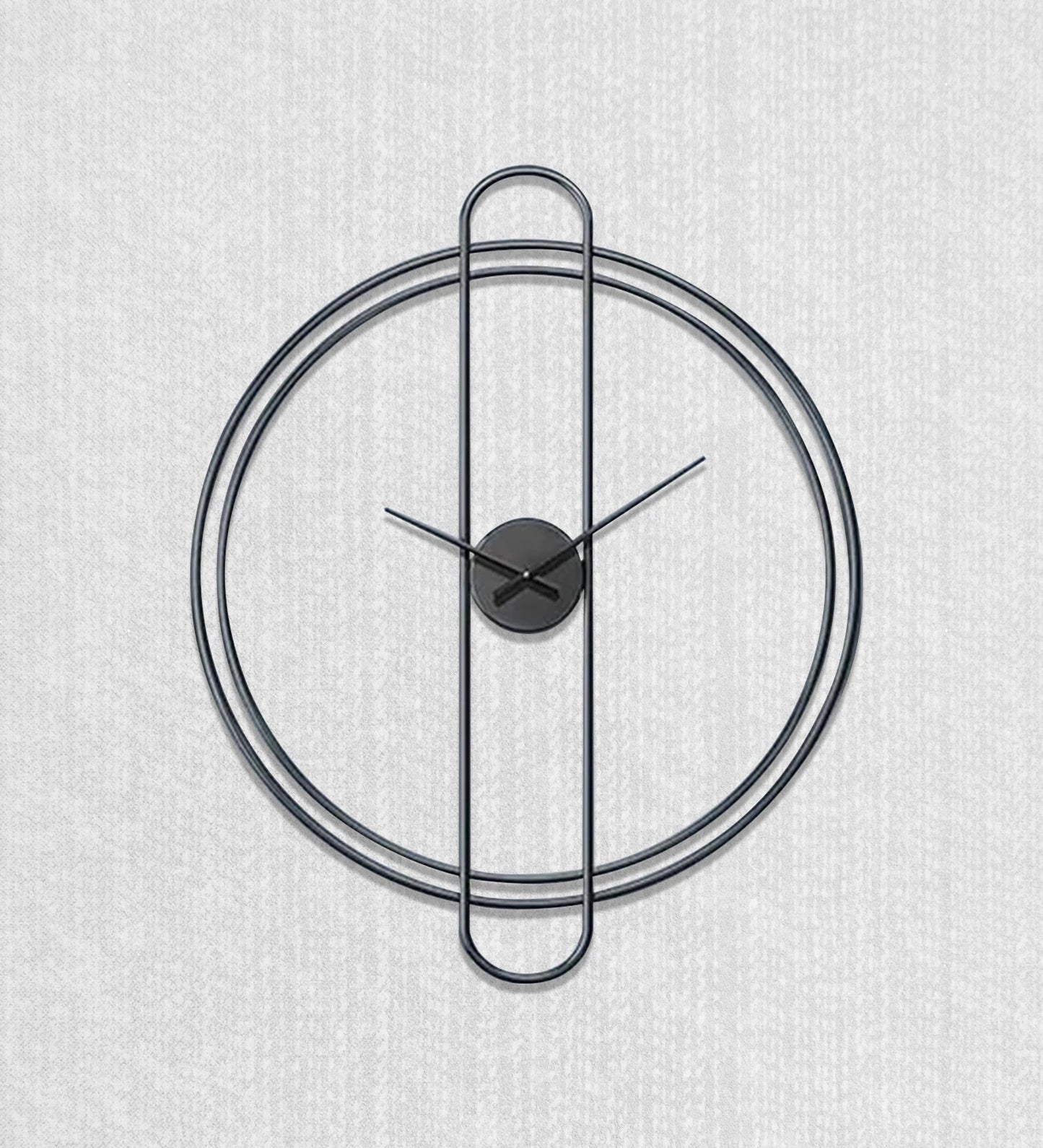 Modern wall clock with black metal design on a light gray background