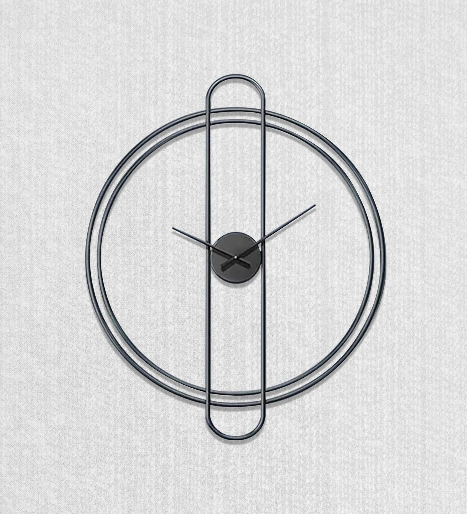 Modern wall clock with black metal design on a light gray background