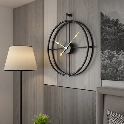 Decorative wall clock on a wooden wall with a lamp and plant in the background