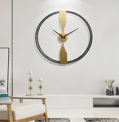 Decorative wall clock with gold accents on a white wall
