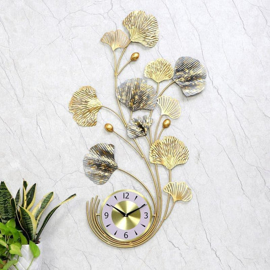 Decorative wall clock with floral design on a textured white background