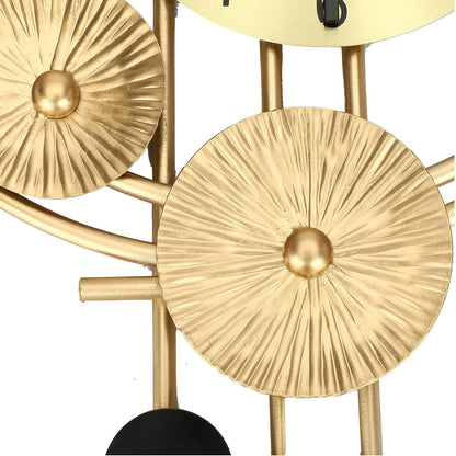 Decorative wall clock with gold circular designs on a white background