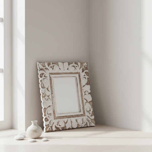Decorative photo frame with intricate patterns on a light surface near a window.